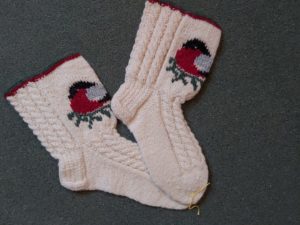 Handknitted socks with bullfinch