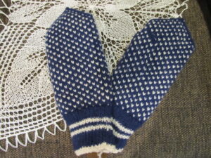 Handknitted mittens with loops inside